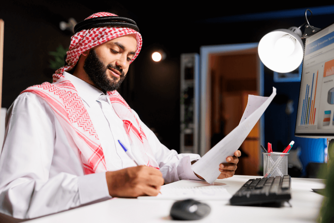 man-diligently-working-his-desk-for-tax